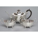 A SILVER THREE PIECE TEA SERVICE, maker Fenton Bros. Ltd., Sheffield 1930, of shaped oval form