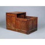 A ROBERT THOMPSON ADZED OAK LOG BOX, pre 1950, of panelled oblong form with one end raised to form a