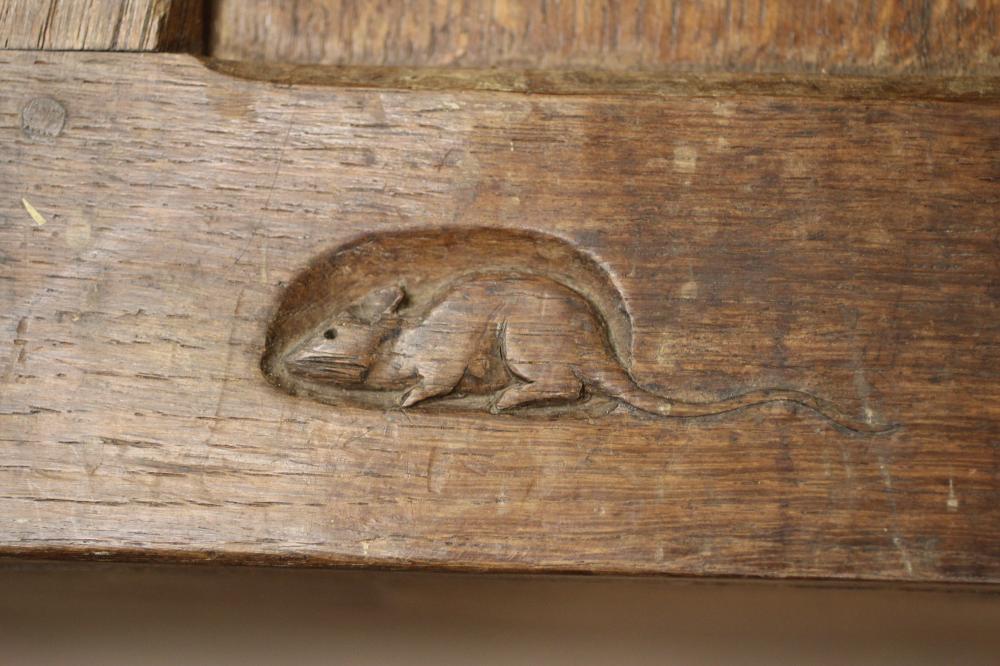 A ROBERT THOMPSON ADZED OAK LOG BOX, pre 1950, of panelled oblong form with one end raised to form a - Image 2 of 2