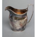 A GEORGE III SILVER MILK JUG, maker possibly Thomas Northcroft, London 1799, of bombe oval form with