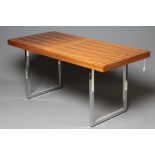 A ROSEWOOD VENEERED AND POLISHED STEEL(?) SIDE TABLE, mid 20th century, the oblong top raised on