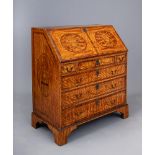 AN INLAID SATINWOOD BUREAU, late 18th century, crossbanded with stringing and with marquetry