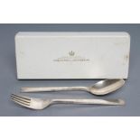 A GEORG JENSEN SILVER DESSERT SPOON AND FORK, stamped Sterling, with tapering angular stems, 7"
