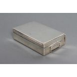 A SILVER SANDWICH BOX, maker Wilfred Chidlaw Griffiths, Birmingham 1919, of plain hinged oblong