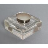 A SILVER MOUNTED INKWELL, maker Richard Comyns, London 1928, the heavy glass base of rounded