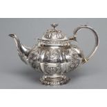 A MID VICTORIAN SILVER TEAPOT, maker's mark WH, London 1864, of melon fluted squat globular form,