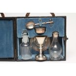 A SILVER TRAVELLING HOLY COMMUNION SET, maker's mark B & W Ld., London 1945, comprising chalice, 3