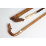 A LADY'S VICTORIAN WALKING CANE, the bamboo shaft with silver(?) collar (marks rubbed), the ivory