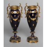 A PAIR OF FRENCH PORCELAIN GARNITURE URNS, c.1900, of slender ovoid form, the dark cobalt blue