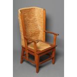 AN ORKNEY OAK CHAIR of Kirkness style, 1970's, with woven straw back and drop-in cord seat, scrolled