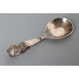 A GEORG JENSEN SILVER CADDY SPOON, London import marks 1957, in Lotus pattern, 4" long (Est. plus