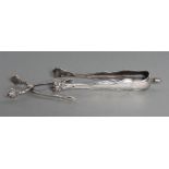 A PAIR OF SILVER SUGAR NIPS, maker Georg Jensen, Sterling, Denmark, in Acanthus pattern, 4" long,