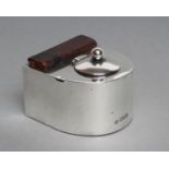 AN EDWARDIAN SILVER INKWELL, maker's mark rubbed, London 1905, of D form, the hinged cover enclosing