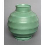 A KEITH MURRAY FOR WEDGWOOD EARTHENWARE VASE of ribbed spherical form in a "Matt Green" glaze,