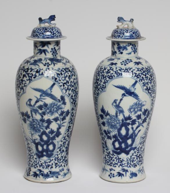 A PAIR OF CHINESE PORCELAIN VASES AND COVERS of inverted baluster form, painted in underglaze blue