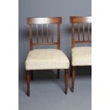 A SET OF SIX GEORGIAN MAHOGANY AND INLAID DINING CHAIRS, c.1800, of Sheraton type, the curved top