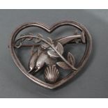 A GEORG JENSEN SILVER HEART BROOCH designed by Arno Molinowski as a pair of dolphins leaping over