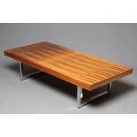 A ROSEWOOD VENEERED AND POLISHED STEEL(?) COFFEE TABLE, mid 20th century, the oblong top raised on