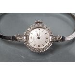 A DIAMOND SET WHITE GOLD VERTEX REVUE COCKTAIL WATCH, the silvered dial with applied line batons,