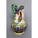 A VICTORIAN MINTON MAJOLICA EWER of lobed baluster form, moulded and applied in high relief with a