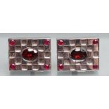 A PAIR OF LARGE CUFFLINKS, the oblong panels set with five facet cut garnets, stamped 925 (Est. plus