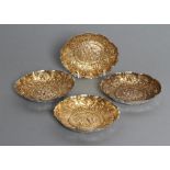 A SET OF FOUR LATE VICTORIAN SILVER DISHES, maker William Comyns, London 1891, of oval form with