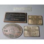 A COLLECTION OF BRONZE SHIP BUILDERS' NAME PLATES including a pair from the Lubecker Flander-Werke