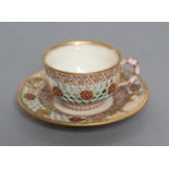 A LATE VICTORIAN ROYAL WORCESTER CHINA RETICULATED CABINET CUP AND SAUCER, 1881 (saucer) and 1882,