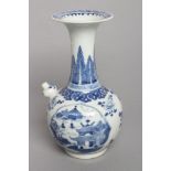 A CHINESE PORCELAIN KENDI painted in underglaze blue with two quatrefoil panels enclosing river