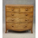 A REGENCY MAHOGANY BOWED CHEST, early 19th century, the caddy top over two short and three long