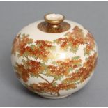 A SATSUMA EARTHENWARE SMALL VASE of bombe cylindrical form, painted in shades of orange and green