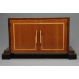 AN ART DECO TWO TONE MAHOGANY SIDEBOARD of oblong form with satinwood banding and ebonised trim, the