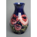 A MOORCROFT POTTERY ANEMONE PATTERN VASE, mid 20th century, of baluster form, tubelined and