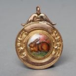A 9CT GOLD FOB centred by a roundel enamelled with a rabbit, the reverse engraved "E.A.F. & F.S.