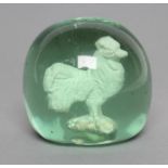 A VICTORIAN GREEN GLASS DUMP of plain domed form enclosing a cockerel sulphide, 2 1/2" high (Est.