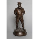 A BRONZE FIGURE OF EDWARD VII modelled standing in riding boots and hat, a cigar to his mouth,