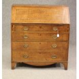 A GEORGIAN OAK BUREAU, c.1800, the fall front with ebony and box stringing enclosing fitted interior