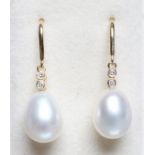 A PAIR OF PEARL AND DIAMOND DROP EARRINGS, the peg set tear shaped pearls pendant from two diamond