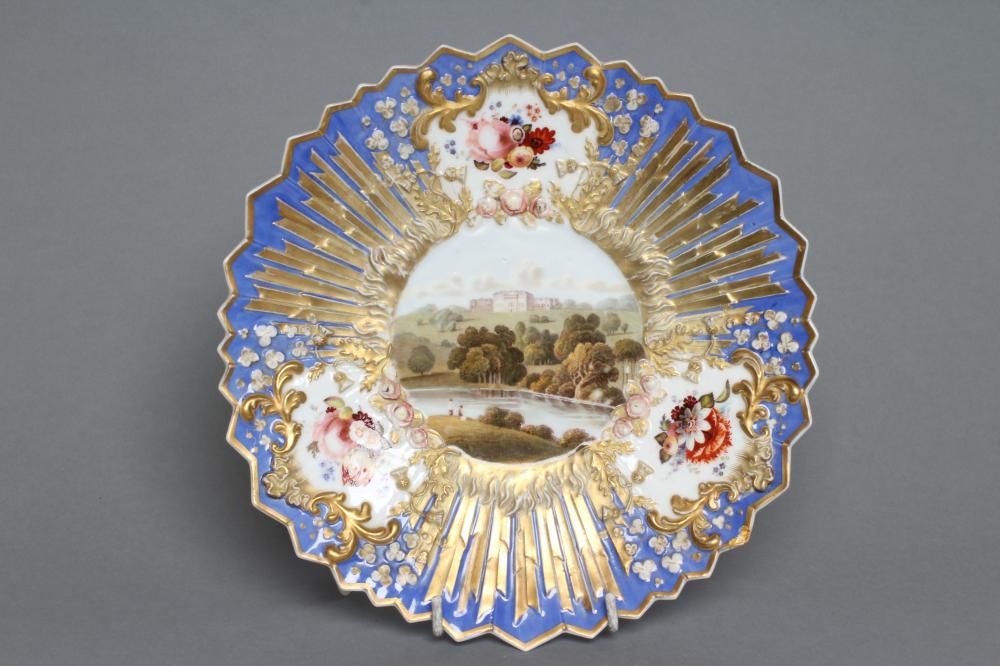 A PORCELAIN CABINET PLATE, 19th century, of circular form with shark's tooth rim, centrally