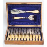 A SET OF TWELVE PAIRS OF EDWARDIAN SILVER FISH KNIVES AND FORKS, maker Harrison, Fisher & Co.,