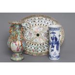 A CANTONESE PORCELAIN OVAL STRAINER painted in famille rose enamels with two panels of figures on