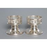 A PAIR OF SILVER CANDLE HOLDERS, maker W.I. Bradbury, Birmingham 2000, Millenium mark, the lattice