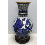 Large Chinese brass cloisonné blue and white vase with carved wooden stand. Decorated with birds and