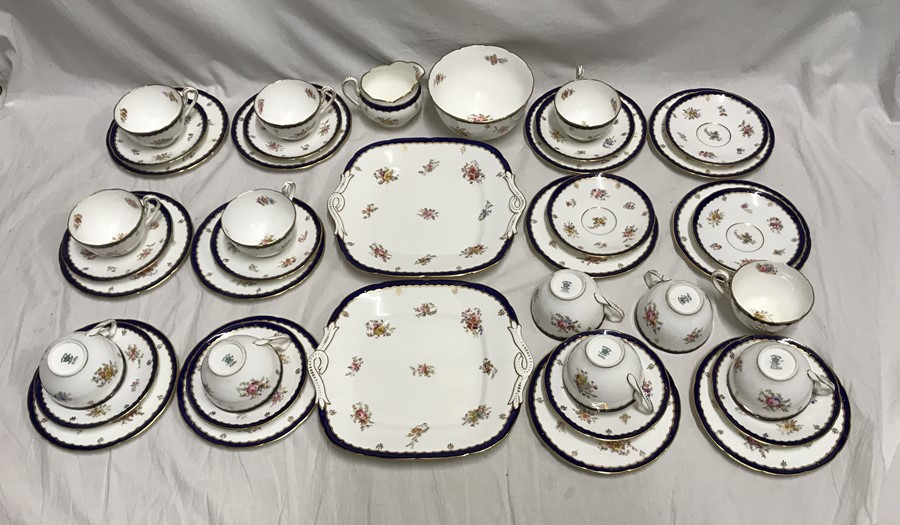 Coalport part tea services. 40 pieces. 12 cups saucers and side plates, 2 cake plates, milk jug