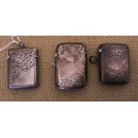 Three hallmarked silver vesta cases, engraved foliage, clear cartouche. HP. Birmingham 1901,