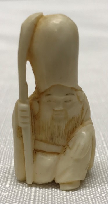 Japanese ivory netsuke, figure of a monk holding a staff. 4cms h.Condition ReportVery good