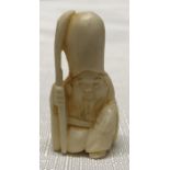 Japanese ivory netsuke, figure of a monk holding a staff. 4cms h.Condition ReportVery good