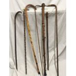 Selection of seven various walking sticks. Embossed dragon design stick, 89cms l, Horn handled stick