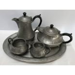 Craftsmen pewter five piece tea set, hammered finish.Condition ReportSome bend to the tray,