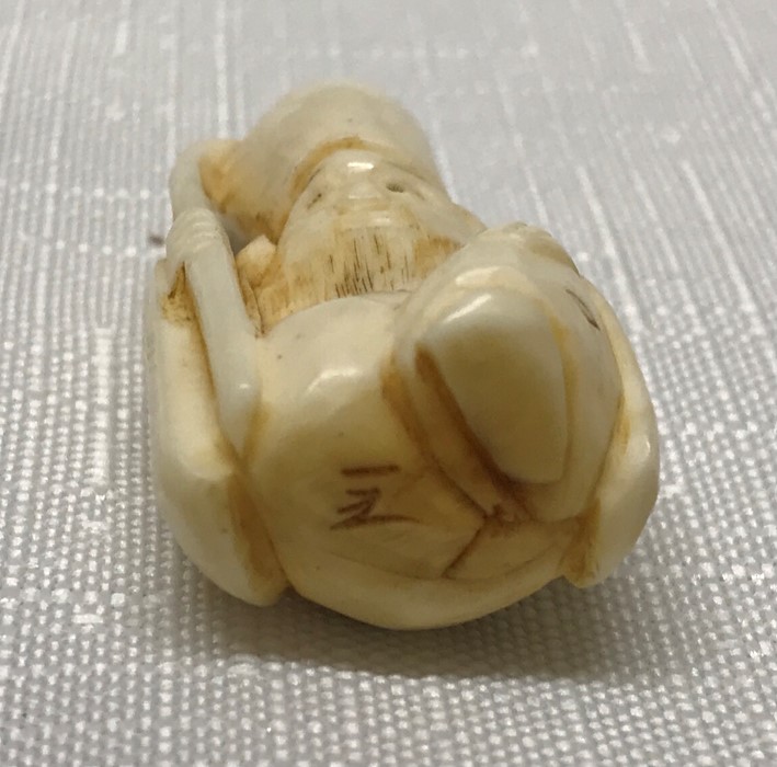 Japanese ivory netsuke, figure of a monk holding a staff. 4cms h.Condition ReportVery good - Image 3 of 3